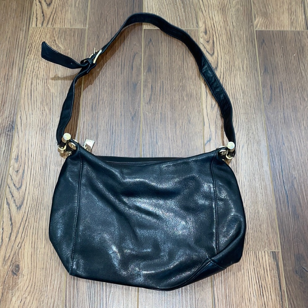 Tignanello black leather purse with two zipper pockets on top & one of the back